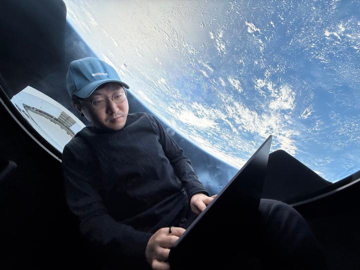 Chun Wang, co-founder of F2Pool, pictured in a suit.