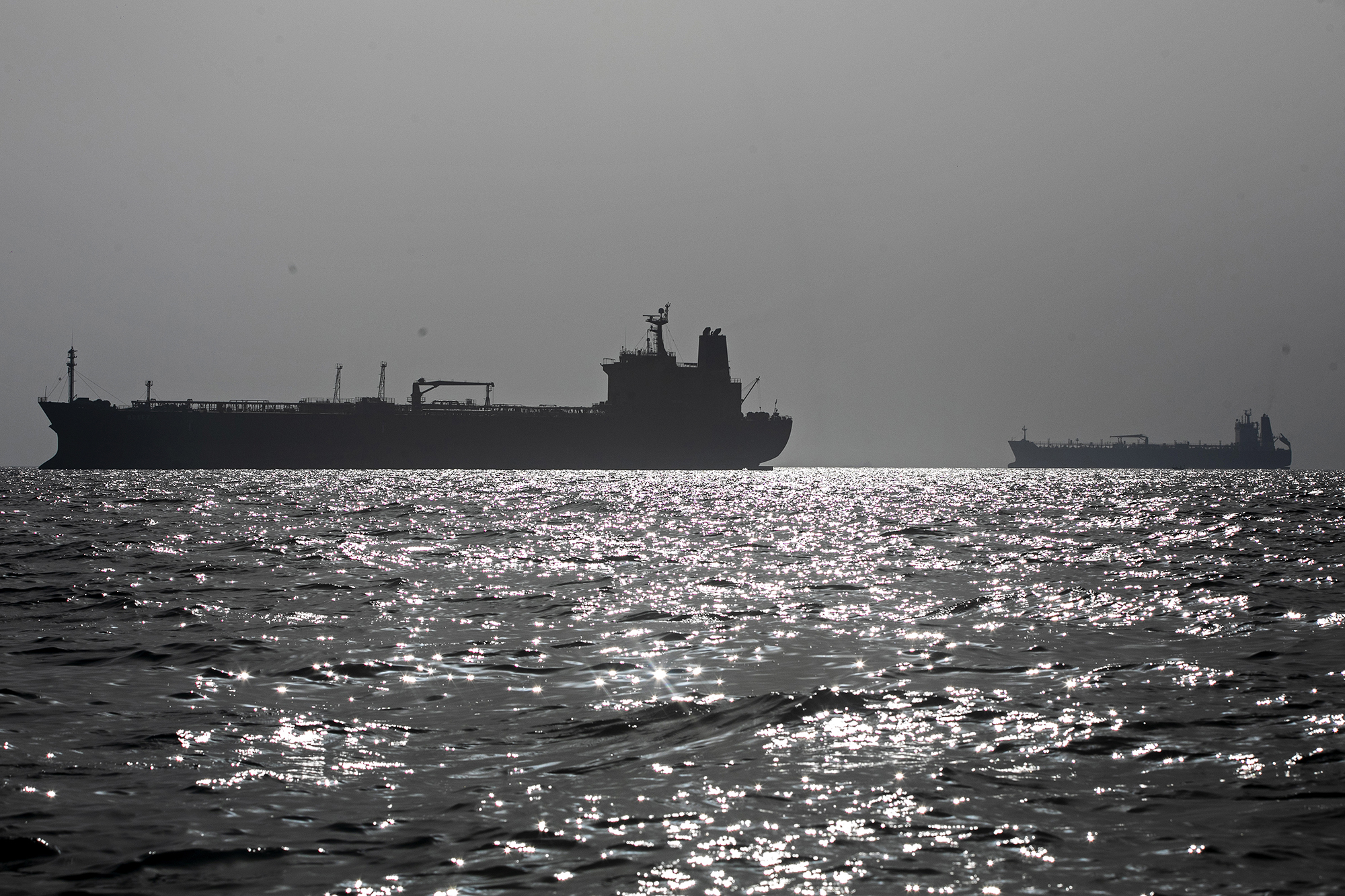 Ships anchored in the Strait of Hormuz near Larak Island, Iran.