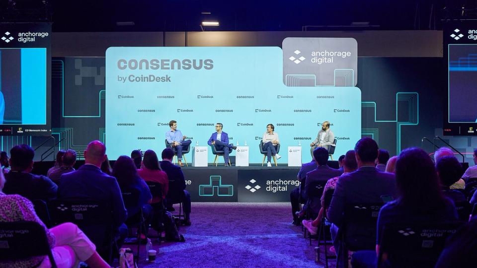 Crypto executives speaking on a panel at Consensus Miami 2026