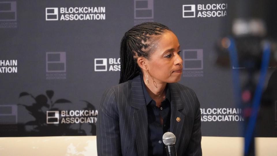 Congressional staffers reviewing revised stablecoin compromise language in a Capitol Hill office