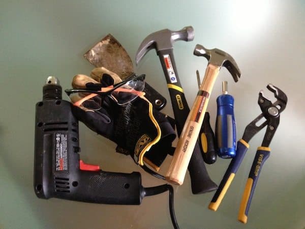 Person looking at phone displaying AI financial advisor interface with savings goals and budget breakdown