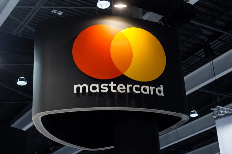 Mastercard logo with a digital network overlay