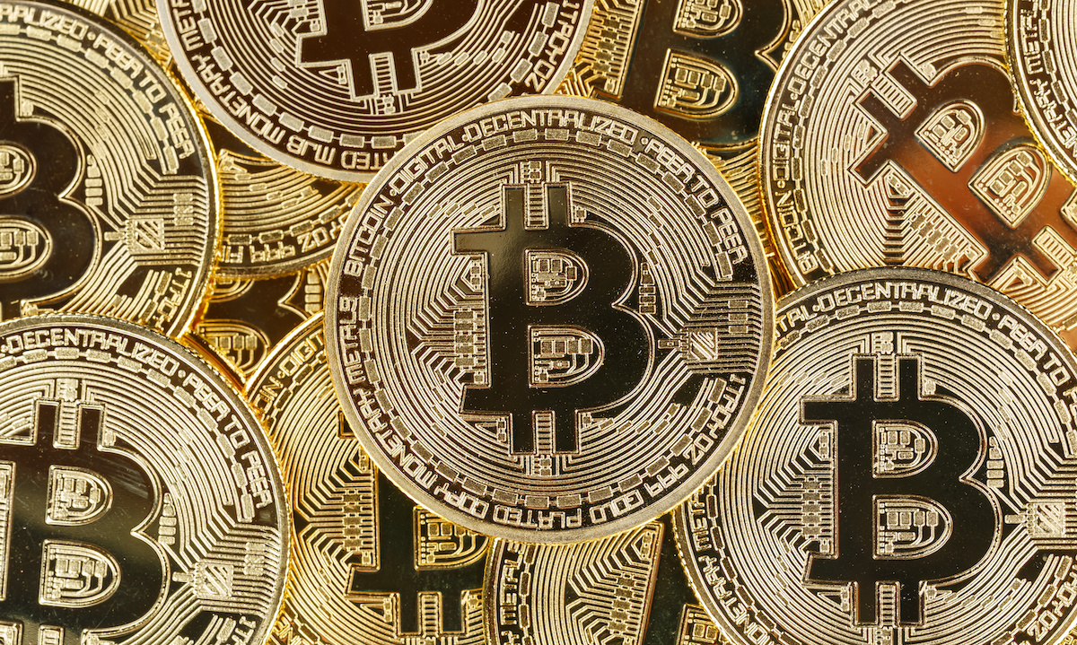 A bank teller smiling and engaging with a customer while a subtle digital currency graphic is visible.